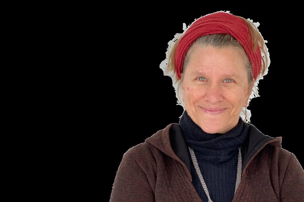 Allison Newsome, head-and-shoulders studio portrait in a red headscarf; the subject is cut out on a transparent background and sits right of center in the frame