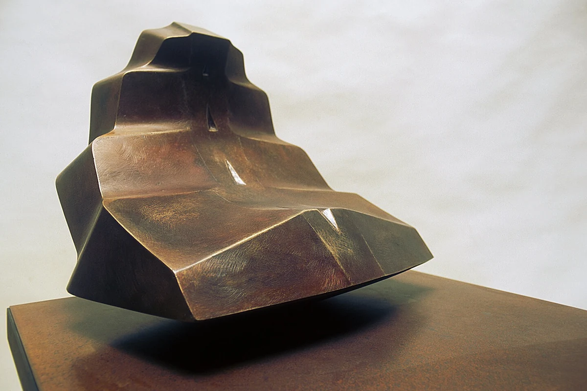 Leaf-buddha, bronze, 18 x 24 x 26 inches, 1999: a faceted bronze seated form with a warm patina, resting on a dark plinth