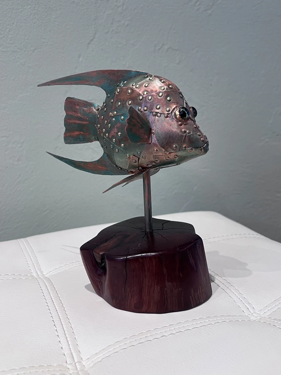 Angel Baby, a riveted copper and patina angelfish sculpture mounted on a turned wood base