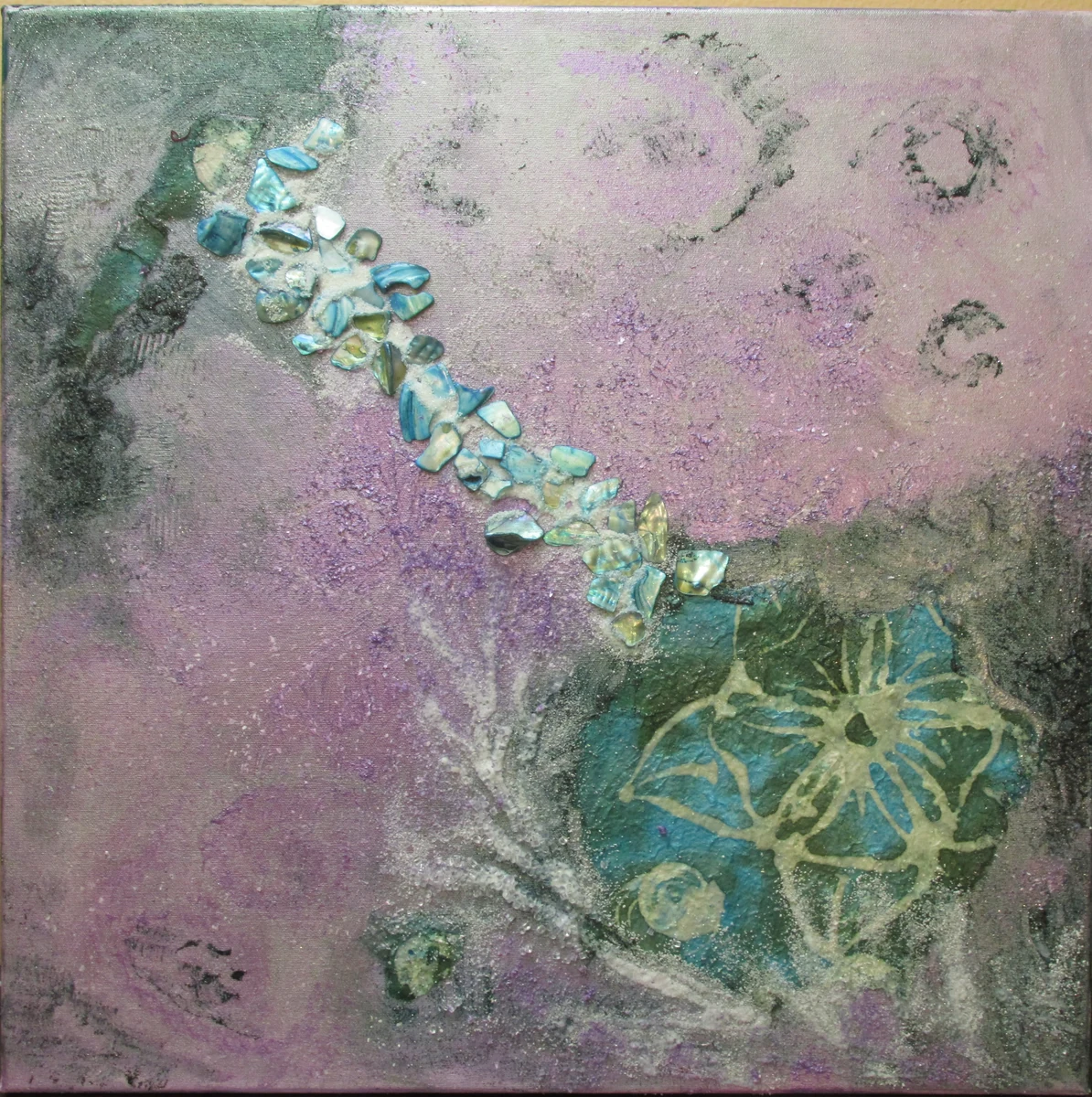 Mixed media painting on canvas: abalone shell fragments set in a diagonal drift across a lavender and sea-green ground, with stencilled flower and spiral forms