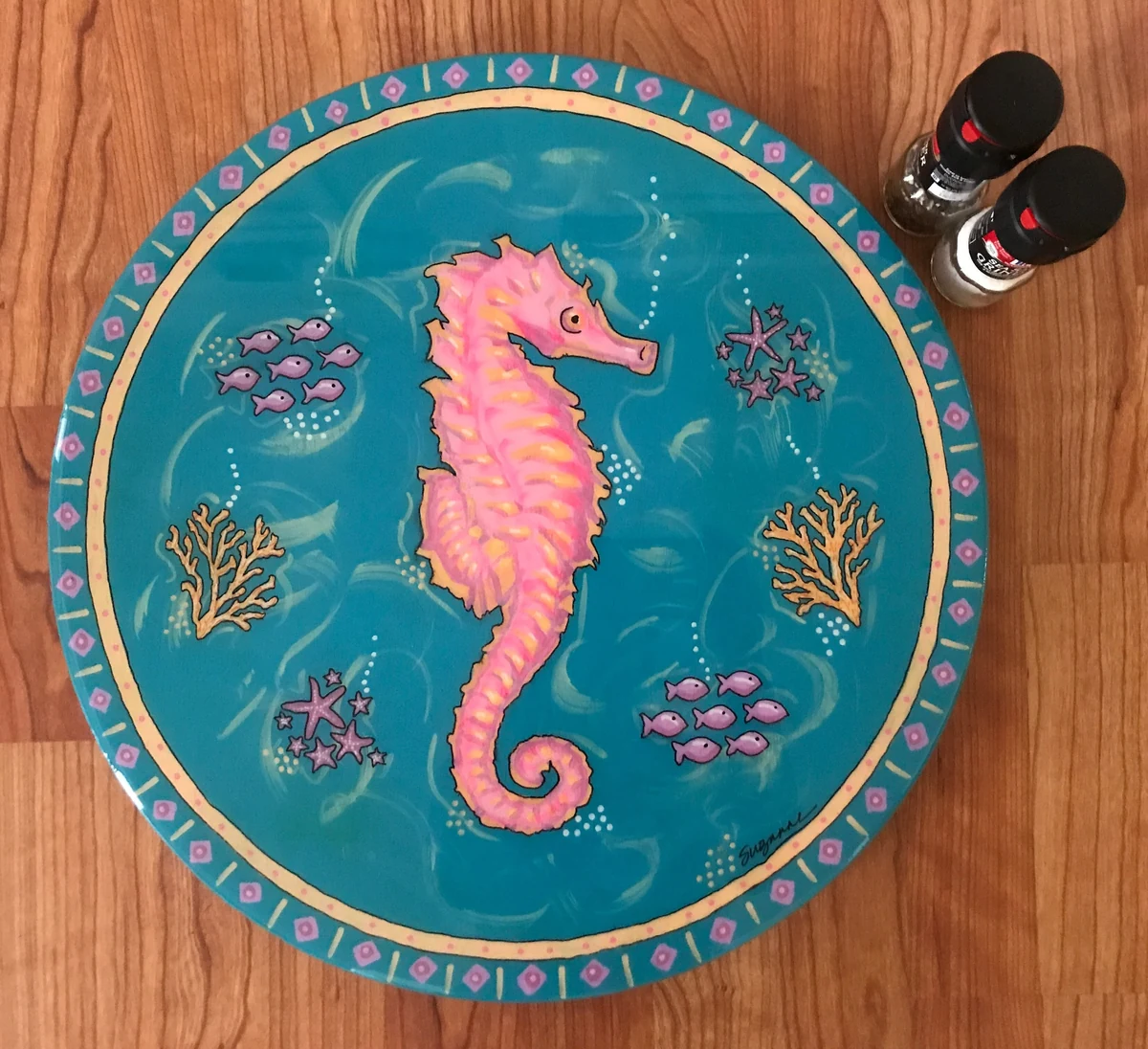Hand painted wooden lazy susan, pink seahorse with fish, starfish and coral on turquoise, signed Suzanne